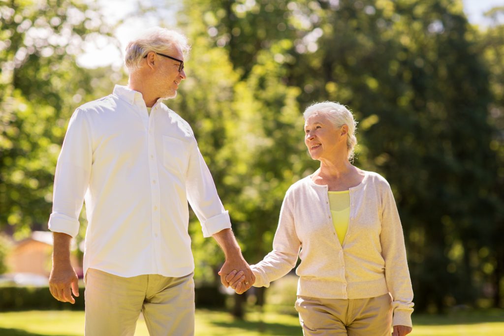 happy senior couple walking at summer park diabetic spouse date ideas